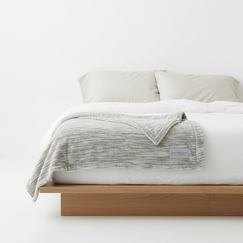 Serenity Weighted Blanket folded on a minimalist bed