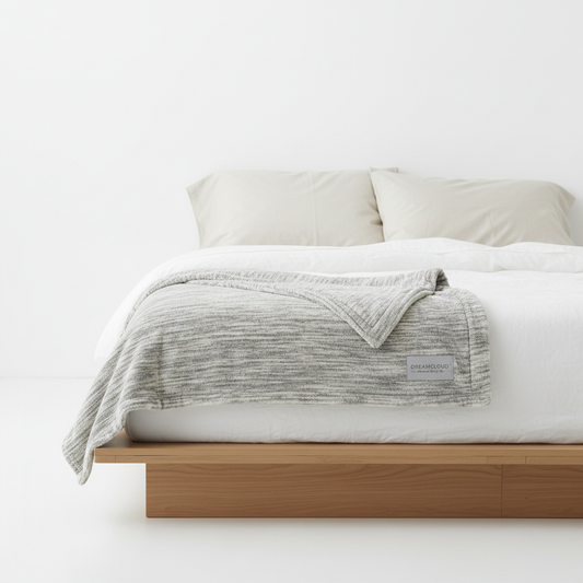 Serenity Weighted Blanket folded on a minimalist bed